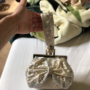 White satin purse with rhinestone and pearls